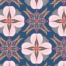 Intricate tiled design with four petal flowers and leave designs. Pinks on navy.